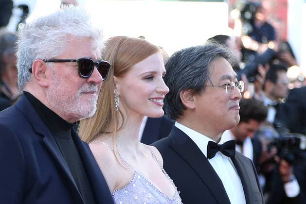 Jury President Pedro Almodovar (L) and jury members Jessica Chastain (C) and Park Chan-Wook arrive on the red carpet before the screening of the film Okja during the 70th annual Cannes International Film Festival in Cannes, France on May 19, 2017.  CAN20170519089 DAVIDxSILPA