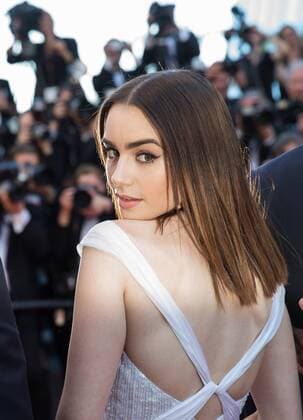 (170519) -- CANNES (FRANCE), May 19, 2017 -- British actress Lily Collins poses on the red carpet for the screening of the film Okja in competition at the 70th Cannes International Film Festival in Cannes, France, on May 19, 2017. ) FRANCE-CANNES-INTERNATIONAL FILM FESTIVAL-OKJA XuxJinquan 