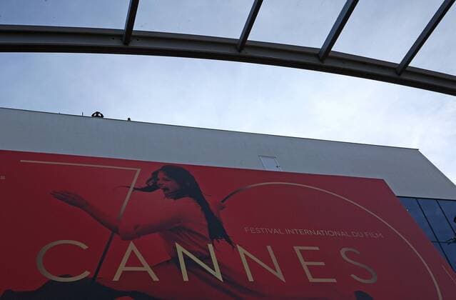 A police officer with binoculars looks out over the Palais des Festival before the screening of the film The Meyerowitz Stories (New and Selected) during the 70th annual Cannes International Film Festival in Cannes, France on May 21, 2017.  CAN20170521089 DAVIDxSILPA