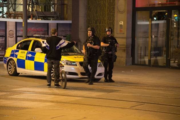 May 23, 2017 - Manchester, England, United Kingdom - Police officers guard the cordoned off area, outside the Manchester Arena, after an explosion after the Ariana Grande concert which took place on 05 22 2017 at Manchester Arena in Manchester, United Kingdom on Tuesday, May 23rd, 2017. Greater Manchester Police are treating this as terrorist incident. Manchester United Kingdom  - ZUMAn230 20170523_zaa_n230_026 Copyright: xJonathanxNicholsonx