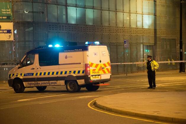 May 23, 2017 - Manchester, England, United Kingdom - A Police van guards the scene of an explosion after an explosion after the Ariana Grande concert at Manchester Arena in Manchester, United Kingdom on Tuesday, May 23rd, 2017. Greater Manchester Police are treating this as terrorist incident. Manchester United Kingdom  - ZUMAn230 20170523_zaa_n230_027 Copyright: xJonathanxNicholsonx