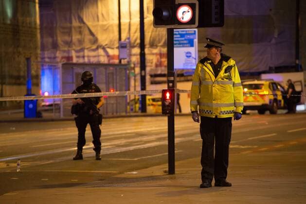 May 23, 2017 - Manchester, England, United Kingdom - A police officer guards the cordoned off area, outside the Manchester Arena, after an explosion after the Ariana Grande concert which took place on 05 22 2017 at Manchester Arena in Manchester, United Kingdom on Tuesday, May 23rd, 2017. Greater Manchester Police are treating this as terrorist incident. Manchester United Kingdom  - ZUMAn230 20170523_zaa_n230_029 Copyright: xJonathanxNicholsonx