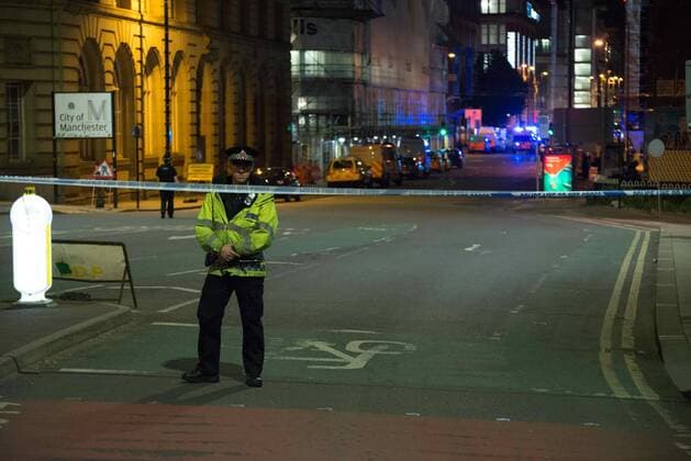 May 23, 2017 - Manchester, England, United Kingdom - A police officer guards the cordoned off area, outside the Manchester Arena, after an explosion after the Ariana Grande concert which took place on 05 22 2017 at Manchester Arena in Manchester, United Kingdom on Tuesday, May 23rd, 2017. Greater Manchester Police are treating this as terrorist incident. Manchester United Kingdom  - ZUMAn230 20170523_zaa_n230_031 Copyright: xJonathanxNicholsonx
