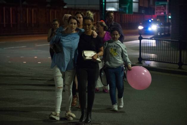 May 23, 2017 - Manchester, England, United Kingdom - People, believed to be leaving the Manchester Arena, after an explosion after the Ariana Grande concert which took place on 05 22 2017 at Manchester Arena in Manchester, United Kingdom on Tuesday, May 23rd, 2017. Greater Manchester Police are treating this as terrorist incident. Manchester United Kingdom  - ZUMAn230 20170523_zaa_n230_040 Copyright: xJonathanxNicholsonx
