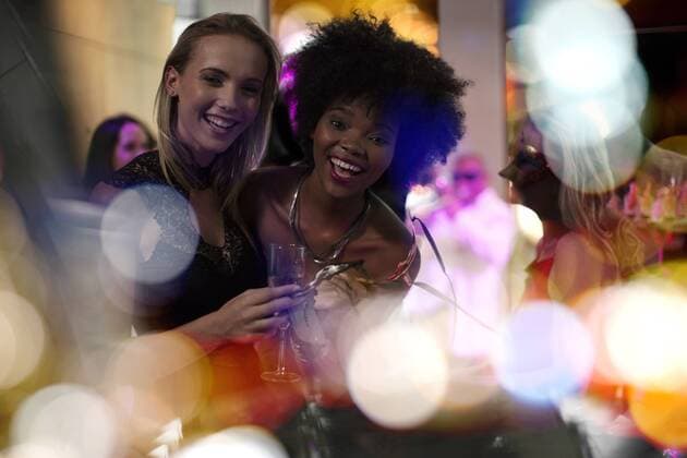 Two women having fun on a party model released Symbolfoto property released  ZEF13581