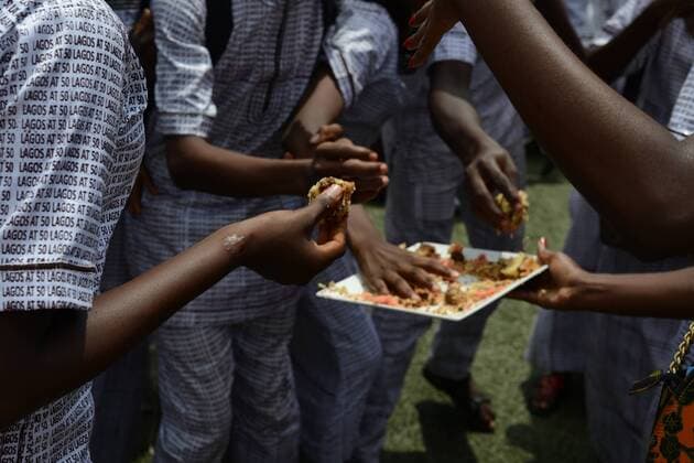 May 27, 2017 - Lagos, Nigeria - Pupils in native attire have fun, pick piece of cake, after their cultural performance during the children s Day parade at Agege Stadium in Lagos Nigeria May 27 2017. Lagos Nigeria  - ZUMAn230 20170527_zaa_n230_693 Copyright: xAdekunlexAjayix