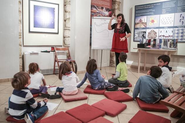 (170528) -- ATHENS, May 28, 2017 -- Storyteller Vassilia Vaxevani (C, Rear) narrates the tale of the four great dragons to inspire children to paint their own Chinese dragons at an art workshop at the Museum Herakleidon in Athens, capital of Greece, on May 28, 2017. Two art workshops brought Greek children closer to the enchanting culture of China at the Museum Herakleidon in Athens on Sunday, in the context of celebrations for the China-Greece Cultural Exchanges and Cultural Industry Cooperation Year in 2017. ) GREECE-ATHENS-GREEK MUSEUM-ART WORKSHOPS-CHINESE CULTURE LefterisxPartsalis 