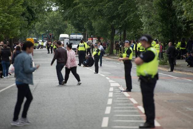 June 4, 2017 - Trafford, England, United Kingdom - Police officers patrol as people arrive for the One Love Manchester benefit concert at the Old Trafford cricket ground in Trafford, United Kingdom, Sunday, June 04, 2017. The One Love Benefit concert has been organised as tribute to the victims of the Manchester Arena attack at which Ariana Grande performed at the Manchester Arena on 05 22 2017. Trafford United Kingdom  - ZUMAn230 20170604_zaa_n230_156 Copyright: xJonathanxNicholsonx