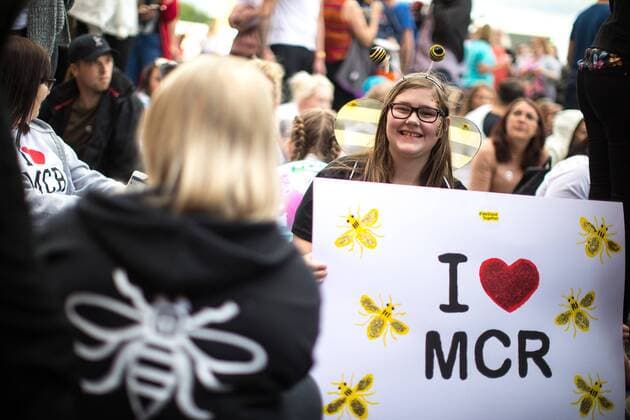 June 4, 2017 - Manchester, Greater Manchester, UK - Manchester , UK . LIBBIE HUNTER (14 from Salford) with a home-made I Love Manchester placard , sitting on the ground in front of the stage . The One Love Manchester benefit concert for victims of the Manchester Arena terrorist attack , at the Emirates Old Trafford Cricket Stadium . Ariana Grande, Justin Bieber, Coldplay, Katy Perry, Miley Cyrus, Pharrell Williams, Usher, Take That, Robbie Williams, Black Eyed Peas and Niall Horan are amongst the performers Manchester UK - ZUMAl94_ 20170604_zaf_l94_185 Copyright: xJoelxGoodmanx