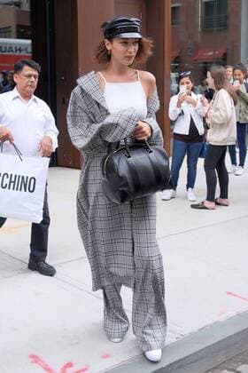 Model Bella Hadid wears a checked pantsuit and military style hat as she leaves her sister Gigi s East Village apartment on June 5 2017 in New York City Bella Hadid New York United States  523420