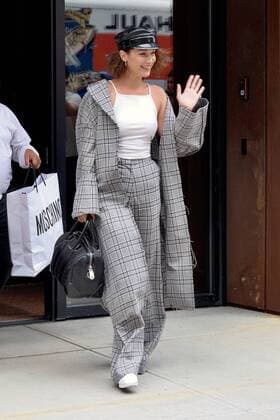 Model Bella Hadid wears a checked pantsuit and military style hat as she leaves her sister Gigi s East Village apartment on June 5 2017 in New York City Bella Hadid New York United States  523420