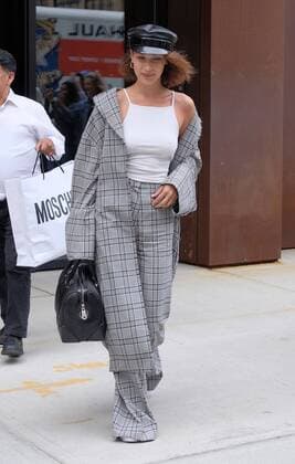 Model Bella Hadid wears a checked pantsuit and military style hat as she leaves her sister Gigi s East Village apartment on June 5 2017 in New York City Bella Hadid New York United States  523420
