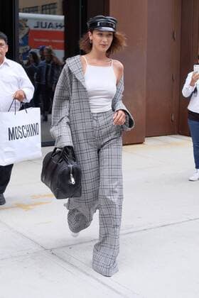 Model Bella Hadid wears a checked pantsuit and military style hat as she leaves her sister Gigi s East Village apartment on June 5 2017 in New York City Bella Hadid New York United States  523420