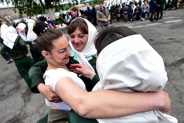 PRIMORYE TERRITORY, RUSSIA â€“ JUNE 7, 2017: Convicts hug after a fashion show at female penal colony No 10 in the village of Gornoye. Prisoners of the colony sew clothes at a garment factory and every year they celebrate Day of Light Industry by presenting the clothes they made. Yuri Smityuk TASS  TS051F5A