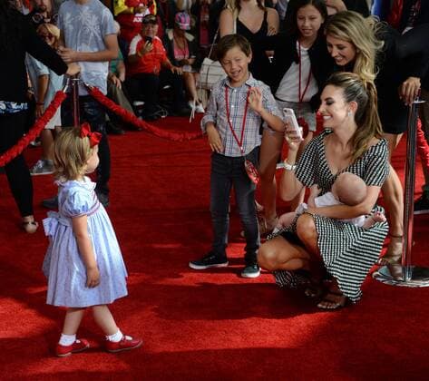 Actress Elizabeh Chambers takes a photo of daughter Harper Hammer while holding Ford Hammer during the premiere of the motion picture comedy Cars 3 at the Anaheim Convention Center in Anaheim, California on June 10, 2017. Storyline: Lightning McQueen sets out to prove to a new generation of racers that he s still the best race car in the world.  LAP2017061041 JIMxRUYMEN