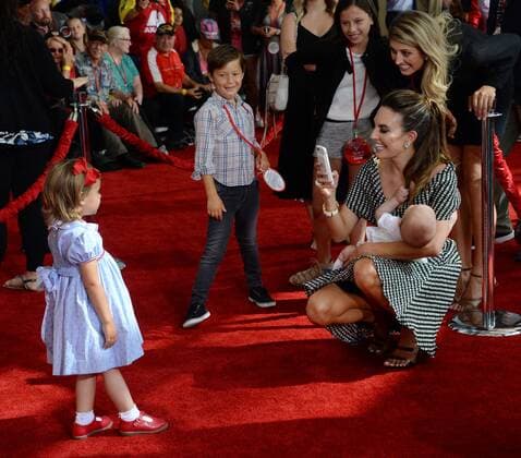 Actress Elizabeh Chambers takes a photo of daughter Harper Hammer while holding Ford Hammer during the premiere of the motion picture comedy Cars 3 at the Anaheim Convention Center in Anaheim, California on June 10, 2017. Storyline: Lightning McQueen sets out to prove to a new generation of racers that he s still the best race car in the world.  LAP2017061043 JIMxRUYMEN