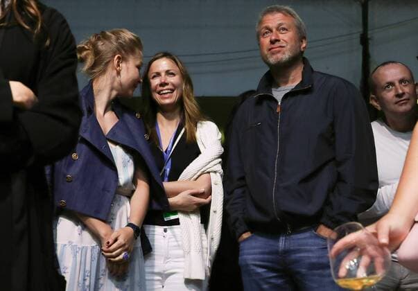 SOCHI, RUSSIA - JUNE 13, 2017: Actress Yulia Peresild, Polina Deripaska, chairperson of the Board of Directors at Forward Media Group Publishing House, and Russian businessman Roman Abramovich (L-R) attend the Zorkiy & the Ladies concert at the 28th Kinotavr Film Festival. Vyacheslav Prokofyev TASS  TS052B1B
