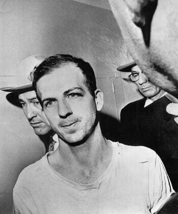 Lee Harvey Oswald, the assassin of President Kennedy in 1963, had defected to the Soviet Union several years earlier, but returned to the U.S. after becoming disillusioned with that country. He is shown here in a Dallas police station after his arrest for Kennedy s shooting, November 23, 1963 Hollywood CA USA  1003_454