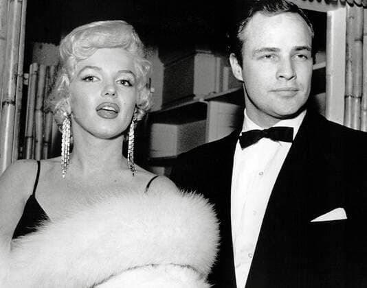 IMAGO ICONS: Marilyn Monroe (Archival Classic Cinema - Marilyn Monroe Retrospective) Marilyn Monroe and Marlon Brando attend the premiere for The Rose Tattoo, 1955 Cinema Publishers Collection Hollywood CA USA  Copyright: xCPCx 31479_081CPC