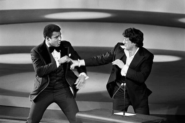 Muhammad Ali and Sylvester Stallone spar, in a memorable moment from the 49th Academy Awards presented March 28, 1977 Hollywood CA USA  32733_352THA