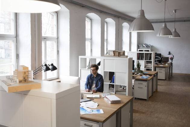 Man working at desk in office model released Symbolfoto property released  FKF02320