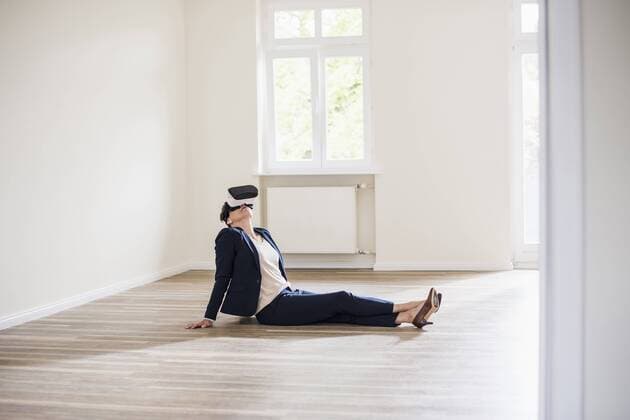 Woman in empty apartment wearing VR glasses model released Symbolfoto property released  UUF10801
