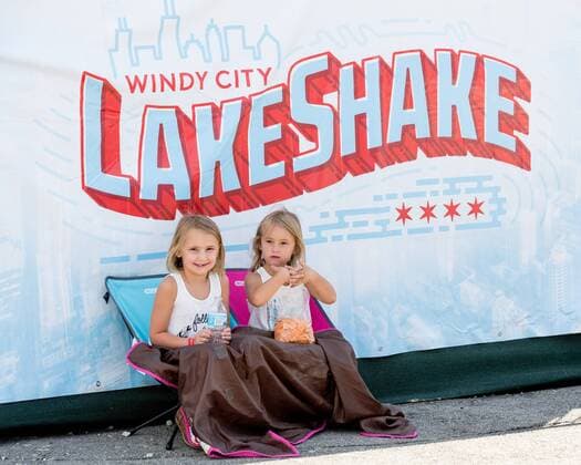 June 24, 2017 - Chicago, Illinois, U.S - Two young music fans find comfort in the shade during Country LakeShake Music Festival at Huntington Bank Pavilion at Northerly Island in Chicago, Illinois Chicago U.S. - ZUMAs135 20170624_zap_s135_066 Copyright: xDanielxDeSloverx