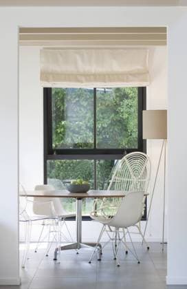 View through open doorway to table and chairs in modern dining room Netherlands  Copyright: xTonxKinsbergenx 14114-150-1