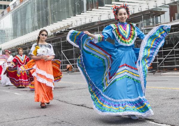 (170702) -- TORONTO, July 2, 2017 -- A participant in Mexican traditional costume performs during the 2017 Canada Day Parade in Toronto, Canada, July 1, 2017. About 1,500 participants in different traditional costumes participated in this event to celebrate Canada s 150th Birthday on Saturday in Toronto. ) (zxj) CANADA-TORONTO-CANADA DAY PARADE ZouxZheng 