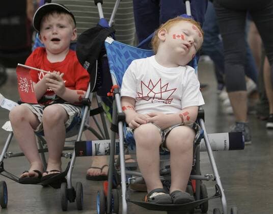 (170702) -- VANCOUVER, July 2, 2017 -- A toddler takes a nap with patriotic stickers on his body during the Canada Day celebration at Canada Place in Vancouver, Canada, July 1, 2017. People gathered at Canada Place in downtown Vancouver to celebrate the 150th anniversary of Canada on Saturday. ) (zxj) CANADA-VANCOUVER-CANADA DAY-CELEBRATION Liangxsen 