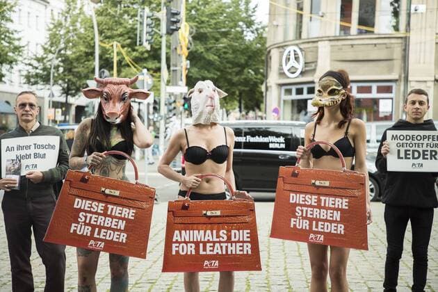 July 4, 2017 - Berlin, Germany - A group of people protest against the use of furs and leather in fashion before the beginning of the Mercedes-Benz Berlin Fashion Week Spring Summer 2018 in front of Jandorf Kaufhaus in Berlin, Germany on July 4, 2017. Berlin Germany  - ZUMAn230 20170704_zaa_n230_155 Copyright: xEmmanuelexContinix
