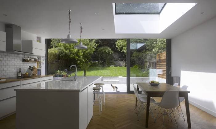 Dining Room and Kitchen in UK home with view through patio doors to garden London London United Kingdom  Copyright: xWillxPrycex 15025-10-1