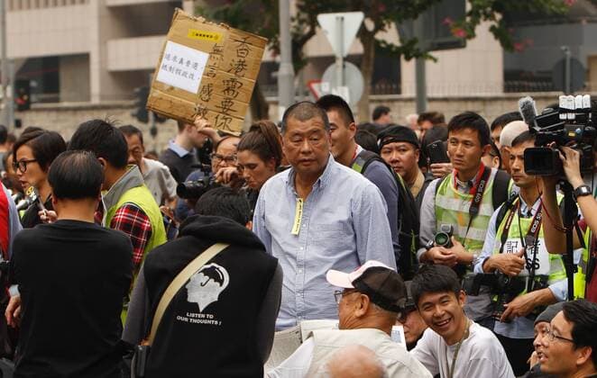 December 11, 2014 - Hong Kong, China - Founder of APPLE DAILY Jimmy Lai ( centre ) during OCCUPATION CENTRAL-UMBRELLA REVOLUTION. Hong Kong media giant NEXT DIGITAL LIMITED controlled by media mogul, JIMMY LAI has accepted an offer to sell some of its magazine businesses in Hong Kong and Taiwan for HK$500 million in a bid to expand remaining digital-news business. ( File photo ) July 19. 2017.Hong Kong.ZUMA Hong Kong China - ZUMAl137 20141211_zap_l137_003 Copyright: xLiauxChungxRenx