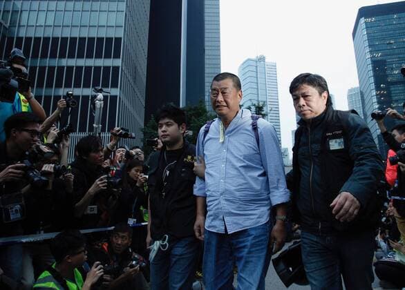 December 11, 2014 - Hong Kong, China - Founder of anti-Beijing Hong Kong newspaper APPLE DAILY, Jimmy Lai ( Centre ) is being detained by the police during OCCUPY CENTRAL-UMBRELLA REVOLUTION. Hong Kong media giant NEXT DIGITAL LIMITED, controlled by media mogul JIMMY LAI, has accepted an offer to sell some of its magazine businesses in Hong Kong and Taiwan for HK$ 500 million in a bid to expand digital-news business. ( File photo ) July 19, 2017.Hong Kong.ZUMA Hong Kong China - ZUMAl137 20141211_zap_l137_004 Copyright: xLiauxChungxRenx