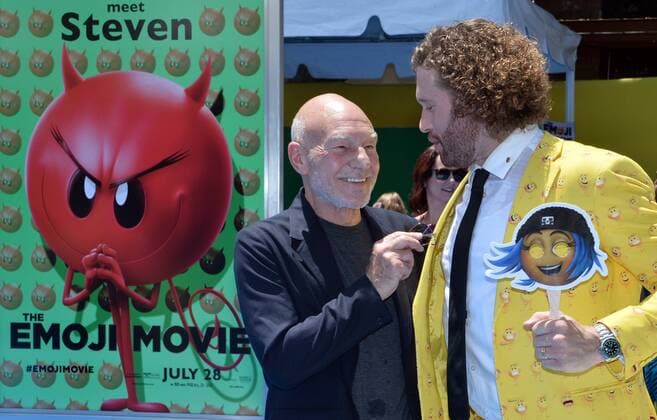 Cast members Patrick Stewart, (L) and T.J. Miller, the voices of Poop and Gene respectively in the animated motion picture comedy The Emoji Movie attend the premiere of the film at the Regency Village Theatre in the Westwood section of Los Angeles on July 23, 2017. Storyline: Gene, a multi-expressional emoji, sets out on a journey to become a normal emoji.  LAP2017072343 JIMxRUYMEN