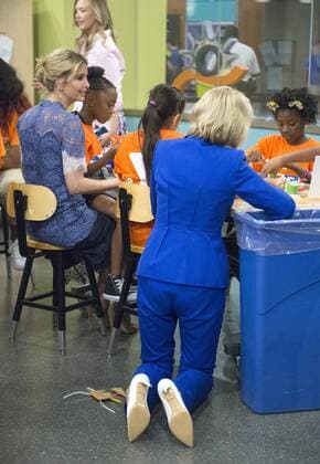 Education Secretary Betsy DeVos (kneeling) and Ivanka Trump interacts and discuss science experiments with early grade school children at the Spark Lab at the National Museum of American History in Washington, DC on July 25, 2017. DeVos and Ivanka Trump focused the event on getting girls excited about STEM studies as they participated in certain science experiments.  WAS2017072523 PatxBenic
