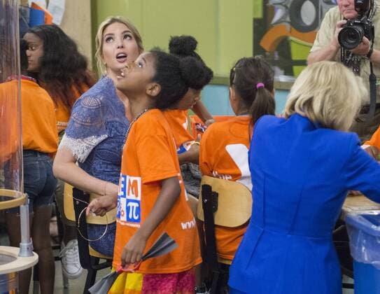 Education Secretary Betsy DeVos (kneeling) and Ivanka Trump interacts and discuss science experiments with early grade school children at the Spark Lab at the National Museum of American History in Washington, DC on July 25, 2017. DeVos and Ivanka Trump focused the event on getting girls excited about STEM studies as they participated in certain science experiments.  WAS2017072524 PatxBenic