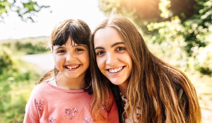Portrait of two smiling girls outdoors model released Symbolfoto  MGOF03429