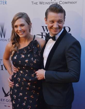 Cast members Elizabeth Olsen and Jeremy Renner attend the premiere of the motion picture crime thriller Wind River at The Theatre at Ace Hotel in downtown Los Angeles on July 26, 2017. Storyline: An FBI agent teams with a town s veteran game tracker to investigate a murder that occurred on a Native American reservation.  LAP2017072629 JIMxRUYMEN