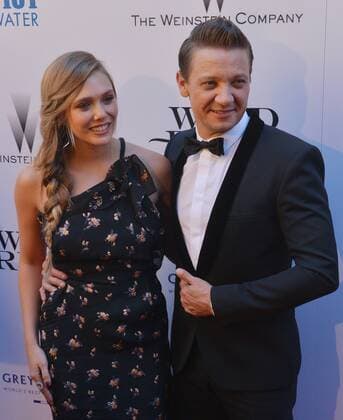 Cast members Elizabeth Olsen and Jeremy Renner attend the premiere of the motion picture crime thriller Wind River at The Theatre at Ace Hotel in downtown Los Angeles on July 26, 2017. Storyline: An FBI agent teams with a town s veteran game tracker to investigate a murder that occurred on a Native American reservation.  LAP2017072654 JIMxRUYMEN