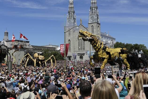 (170729) -- OTTAWA, July 29, 2017 -- Long Ma (R), a giant mechanical mythical horse, and Kumo, a giant mechanical spider, both brought by the company La Machine, take part in the celebration of Canada s 150th birthday year, in Ottawa, Canada on July 28, 2017. The company La Machine brought their two giant creatures, the horse-dragon named Long Ma and the spider named Kumo, to roam the streets of Ottawa to be a part of the celebration for Canada s 150th birthday year. ) (zw) CANADA-OTTAWA-150TH BIRTHDAY-CELEBRATION DavidxKawai