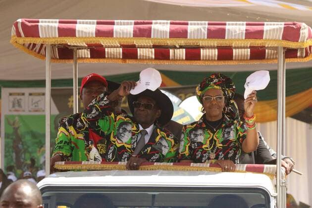 (170730) -- CHINHOYI (ZIMBABWE), July 30, 2017 -- Zimbabwean President Robert Mugabe (L, front) and his wife Grace Mugabe attend a ZANU-PF rally in Chinhoyi, Mashonaland West, Zimbabwe, July 29, 2017. Zimbabwean President Robert Mugabe said on Saturday he is not about to step down leaving behind a fractured party. He said he was taking his time to anoint a successor until he is convinced that the party is united and that the person to succeed him has attained the same stature and acceptance as I have managed to secure over the years for the party . ) (zw) ZIMBABWE-CHINHOYI-MUGABE stringer 
