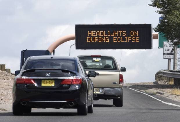 August 21, 2017 - Albuquerque, NM, U.S. - 2017---A sign on northbound I-25 warns motorists to turn on their headlights during Monday s solar eclipse in Albuquerque, photographed on Monday August 21, 2017. Albuquerque U.S. - ZUMAab1_ 20170821_zaf_ab1_004 Copyright: xDeanxHanson AlbuquerquexJournalx