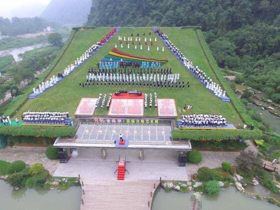ZHANGJIAJIE, CHINA - AUGUST 21: Chorus perform on the roof of a music hall during the 2017 Huanglong Music Festival and International Chorus Week on August 21, 2017 in Zhangjiajie, Hunan Province of China. 112 teams will compete in the 2017 Huanglong Music Festival and International Chorus Week held in Zhangjiajie.  Copyright: xVCGx CFP111123804202