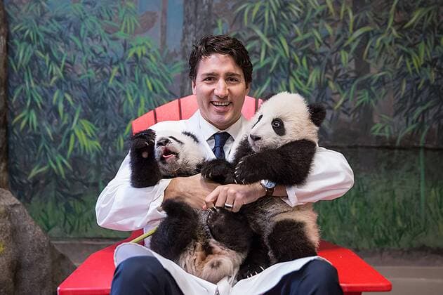 (170831) -- TORONTO, Aug. 31, 2017 -- File photo shows Canadian Prime Minister Justin Trudeau cuddling panda twin cubs at the Toronto Zoo in Toronto, Canada, March 7, 2016. The 139th Canadian National Exhibition held in Toronto from Aug. 18, 2017 to Sept. 4 displays works of a butter sculpture competition, one of which is based on this photo. Canadian Prime Minister s Office) (gj) CANADA-TORONTO-BUTTER SCULPTURE-JUSTIN TRUDEAU-PANDA TWIN CUBS ZouxZheng 