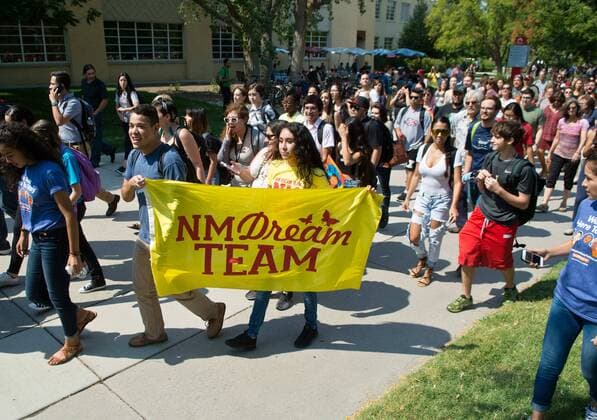 September 5, 2017 - U.S. - Marla Brose -- Hundreds of University of New Mexico students, staff and faculty, including Anacaren Ruiz, third from left, and Jorge Guerrero, second from left, both UNM seniors, who hold a NM Dream Team flag, march around campus, chanting in support of immigrants and DACA students who may be affected by President Trump s proposed policy changes, Tuesday, Sept. 5, 2017, in Albuquerque, N.M. U.S. - ZUMAab1_ 20170905_zaf_ab1_019 Copyright: xAlbuquerquexJournalx