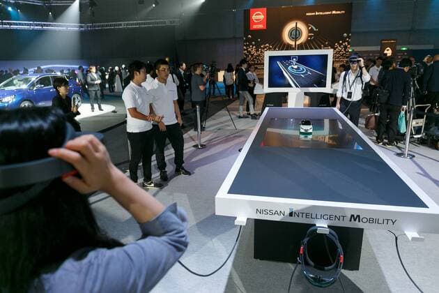 Members of the media test a Nissan Intelligent Mobility simulator during a World Premiere event for the new Nissan LEAF at Makuhari Messe Convention Center on September 6, 2017, Chiba, Japan. Hiroto Saikawa, Nissan President and CEO, introduced the new model LEAF which has an extended range of 400km per charge and includes Nissan s ProPILOT autonomous driving technology. The zero emission vehicle will be available in Japan from October 2nd and in the US, Canada and Europe from January 2018.  (gxta_nissanleafworldpremiere049)