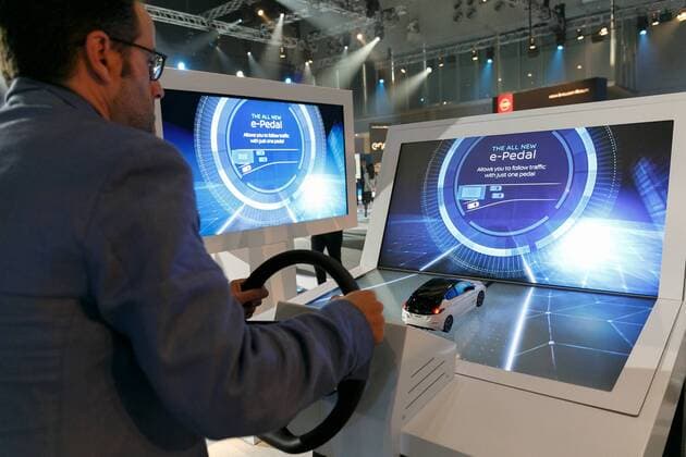 A man tests an e-Pedal simulator during a World Premiere event for the new Nissan LEAF at Makuhari Messe Convention Center on September 6, 2017, Chiba, Japan. Hiroto Saikawa, Nissan President and CEO, introduced the new model LEAF which has an extended range of 400km per charge and includes Nissan s ProPILOT autonomous driving technology. The zero emission vehicle will be available in Japan from October 2nd and in the US, Canada and Europe from January 2018.  (gxta_nissanleafworldpremiere051)