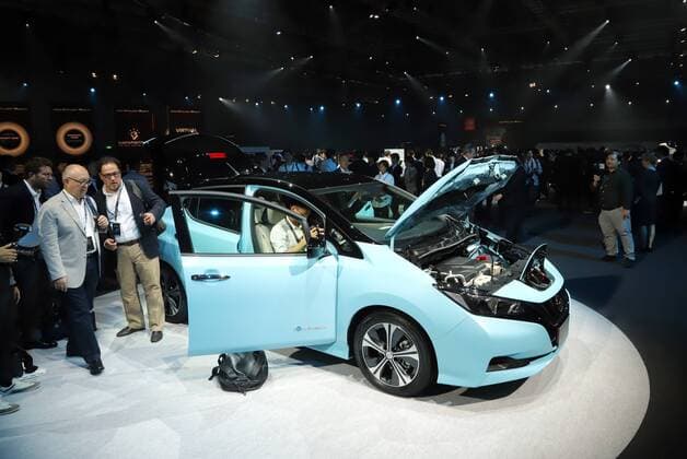 September 6, 2017, Chiba, Japan - Journalists check Japanese automobile giant Nissan Motor s new electric vehicle Leaf in Chiba, suburban Tokyo on Wednesday, September 6, 2017. The new Leaf, featuring cruising distance of 400km with an eight-hour quick charge, will go on sale in Japan from October 2.  (lwxa013382)