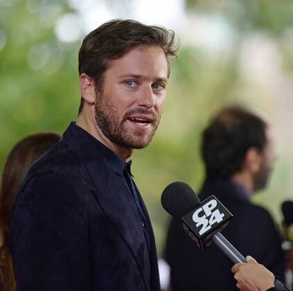 Armie Hammer speaks with television reporters as he arrives at the premiere of Call Me By Your Name on opening night of the 42nd Toronto International Film Festival at Ryerson Theatre in Toronto, Canada on September 7, 2017.  TOR2017090725 CHRISTINExCHEW